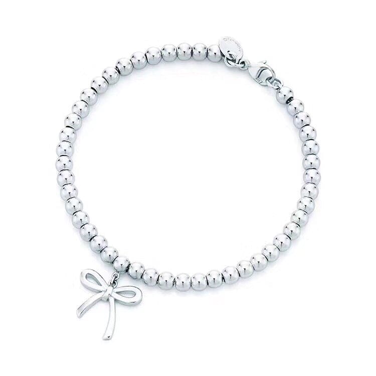 Roostick Bow Charm Bead Bracelet