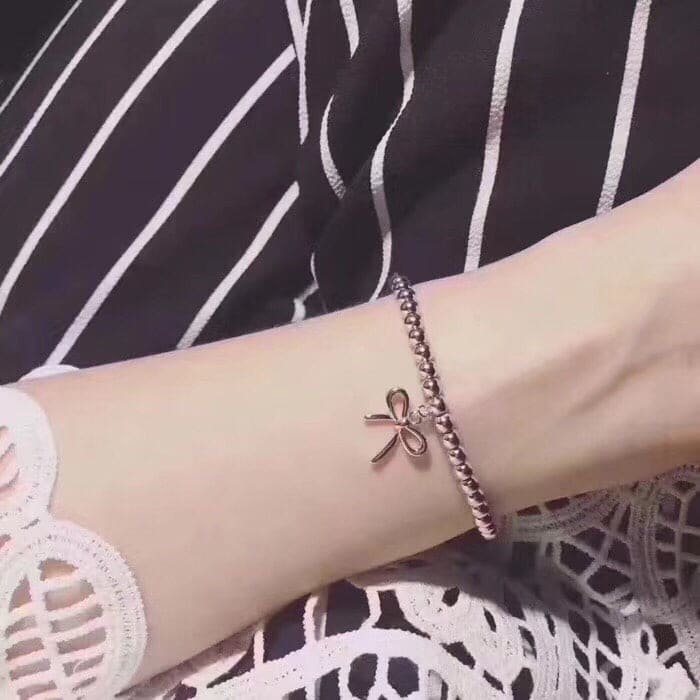 Roostick Bow Charm Bead Bracelet