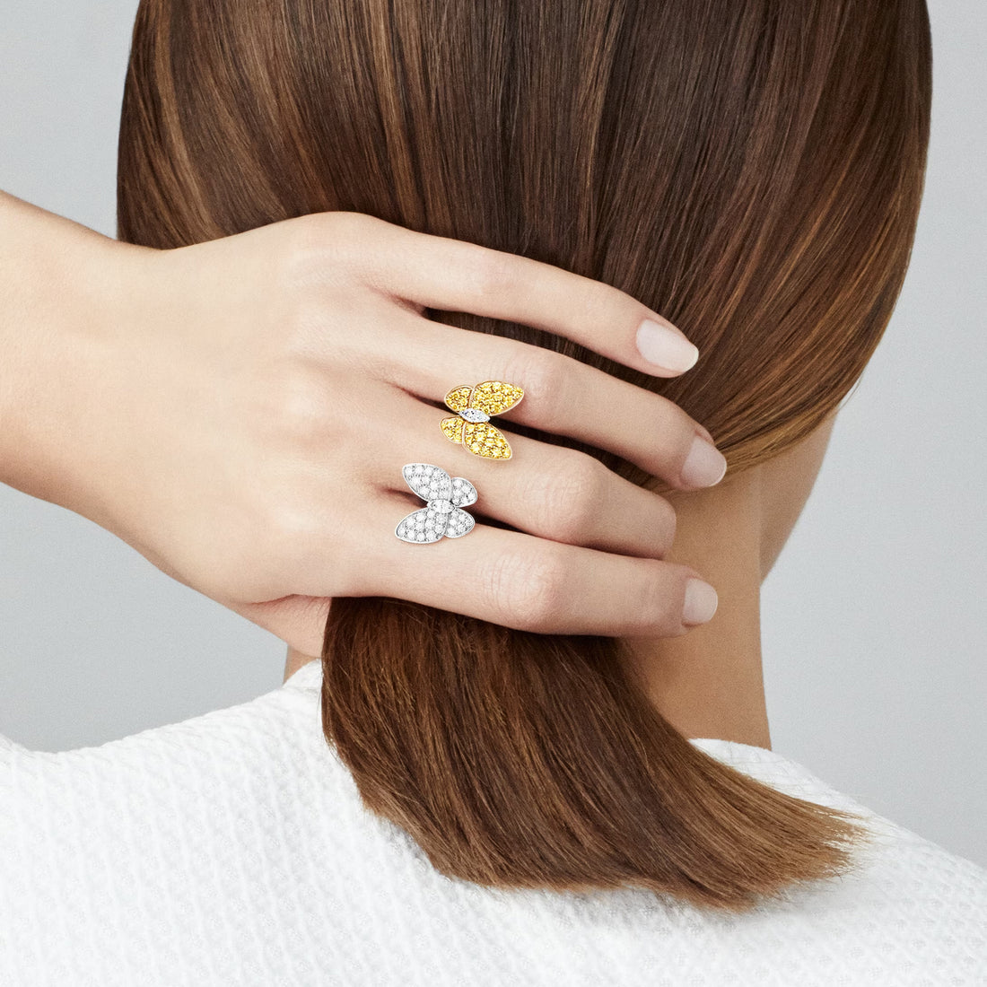 Two Butterfly Between the Finger Ring