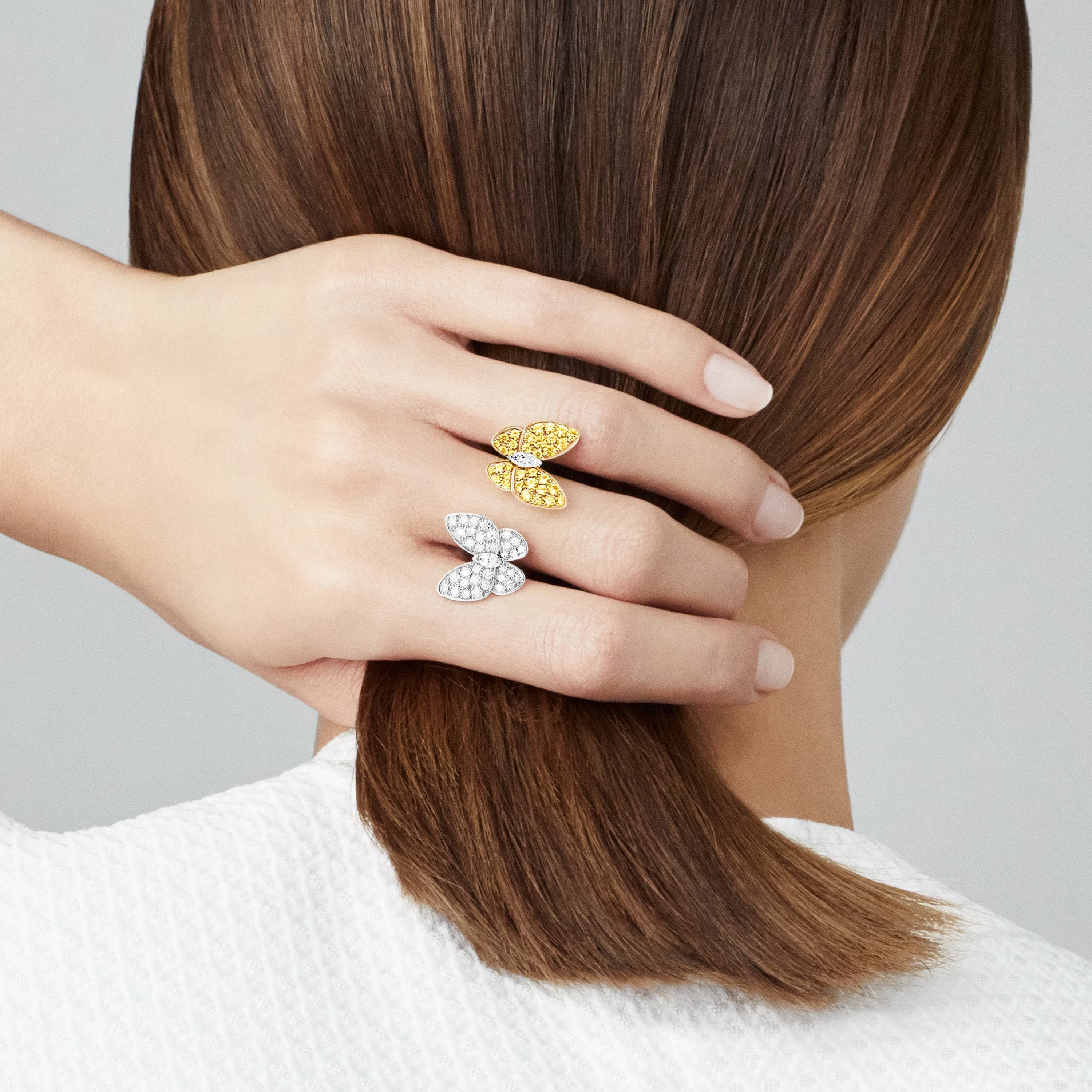 Two Butterfly Between the Finger Ring